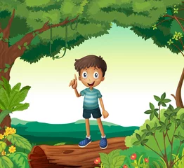 Fototapeten Ein Junge steht auf Holz in der Natur © GraphicsRF