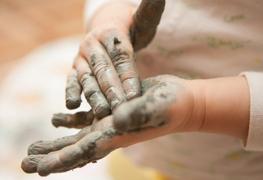 Little Girl Modelling Clay Toy