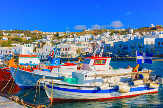 Colorful wooden fishing boats on row  Mykonos island old port Gr