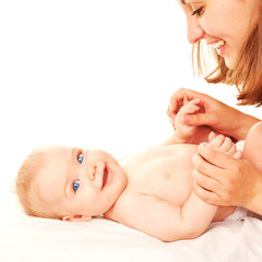 Happy mother and baby playing and laughing.