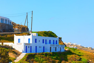Traditional view of land with grass and whitewashed houses © korpithas
