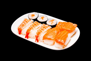 sushi in white plate on black background