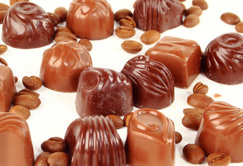 sweet chocolate candies and coffee beans