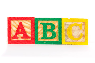 ABC wooden learning blocks in a row