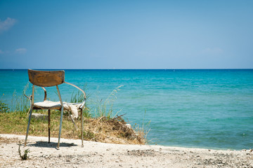 Lonely old chair on beach