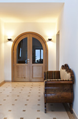 beautiful apartment, interior, corridor with antique sofa