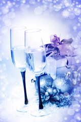 New Year and Christmas Celebration .Two Champagne Glasses in Hol