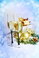 New Year and Christmas Celebration .Two Champagne Glasses in Hol