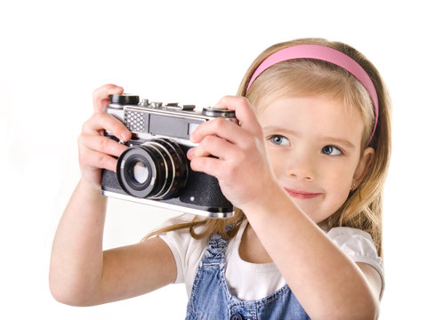 Photographing little girl with old camera isolated