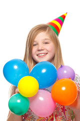 girl with party hat and balloons