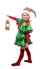 Girl in suit of Christmas elf with oil lamp