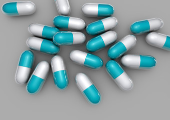 light blue pills isolated on grey