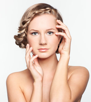 Portrait of young woman with braid hairdo