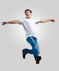 Young man dancing and jumping