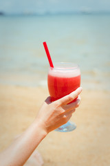Fresh fruit cocktail on a tropical island beach