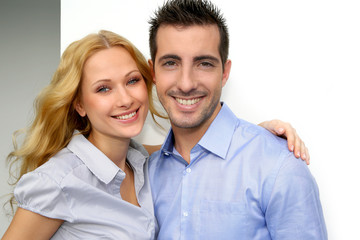 Cheerful couple looking at camera