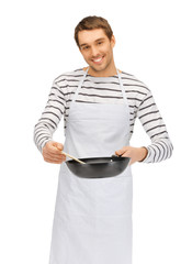 handsome man with pan and spoon