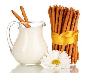 Tasty crispy sticks with pitcher with sour cream isolated