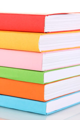Stack of multicolor books  isolated on white