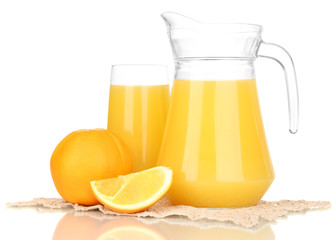 Full glass and jug of orange juice and oranges isolated on