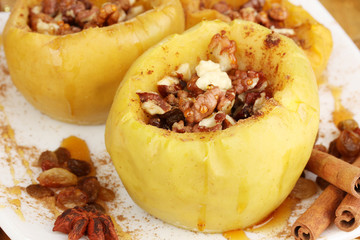 Baked apples on plate close up