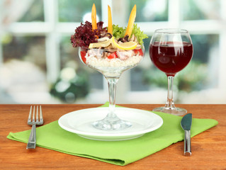 Delicatessen seafood salad with rice in glass