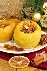 Baked apples on plate close up