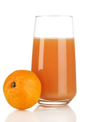Delicious tangerine juice in glass and mandarin next to it