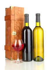 Wooden case with wine bottles isolated on white