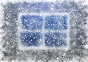 Snow-covered window and falling snowflakes