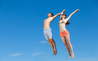 Happy Young Couple Together On The Beach