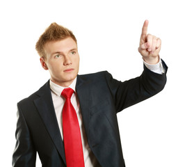 Portrait of a happy young man pointing at something