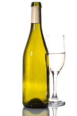 Bottle of white wine and glass over light grey background