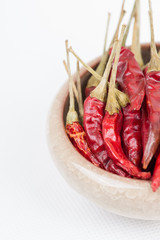Red pepper in bowl on white background