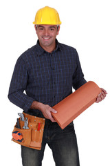 Smiling roofer standing on white background