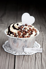 Chocolate cupcake on wooden table