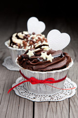 Chocolate cupcakes on wooden table