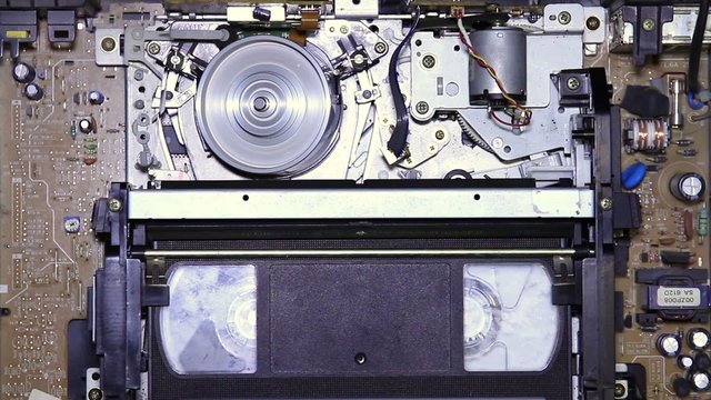 VHS tape eject from VCR inside vision