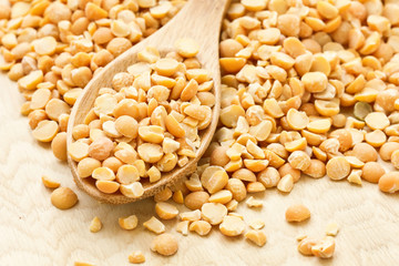 Dry peas on wooden background