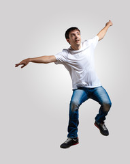 Young man dancing and jumping