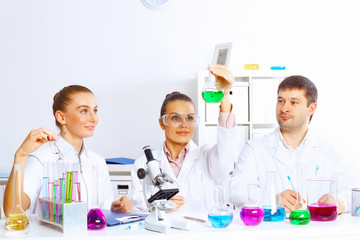 Team of scientists working in laboratory