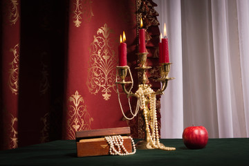 Composition with apple, candlestick and jewellery box