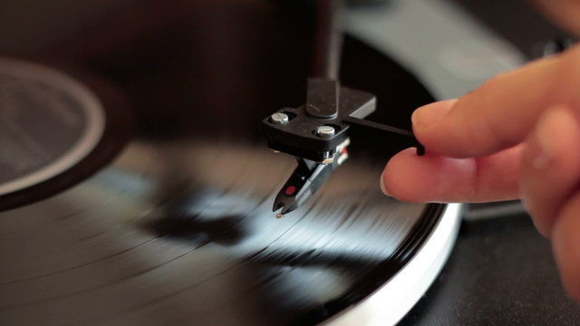 Needle being lowered onto record