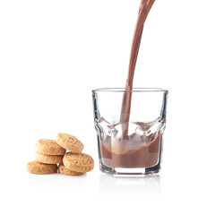 Chocolate splash in a glass with cookies