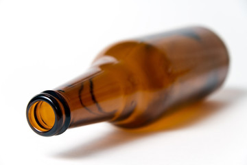 Brown beer bottle on a white background