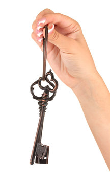 Woman's hand with keys, on white background close-up