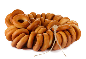 tasty bagels on rope, isolated on white