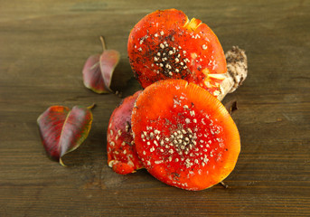 red amanitas, on wooden background