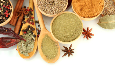 wooden bowls and spoons with spices, isolated on white