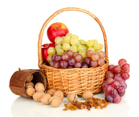 Grape in basket with nuts isolated on white